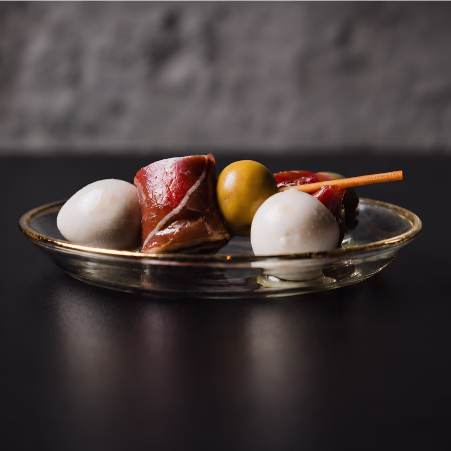 Gilda with cured beef and quail egg